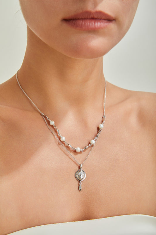 Double-layered gold pearl necklace with 925 sterling silver and freshwater pearls  
Delicate gold vermeil pearl necklace – Celestial Bloom by Petite Secret  
Elegant pearl necklace for layering – Petite Secret Jewellery.