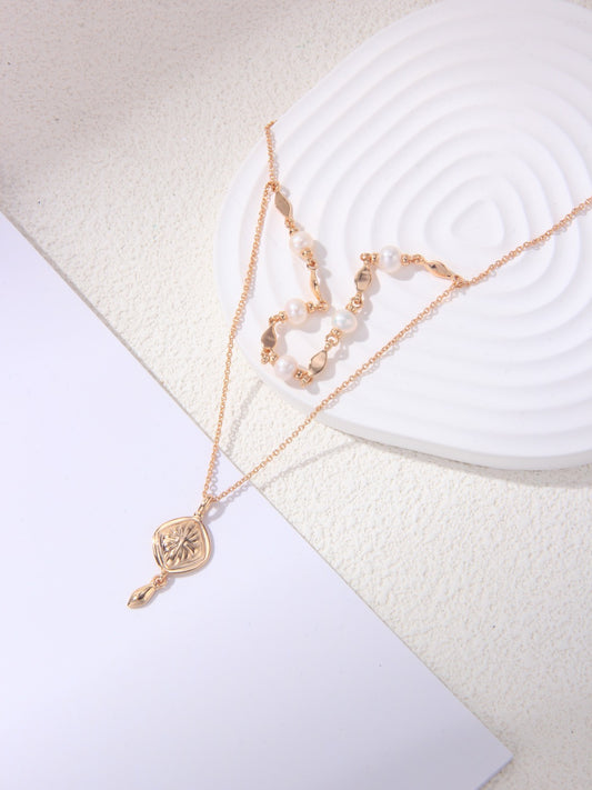 Double-layered gold pearl necklace with 925 sterling silver and freshwater pearls  
Delicate gold vermeil pearl necklace – Celestial Bloom by Petite Secret  
Elegant pearl necklace for layering – Petite Secret Jewellery.